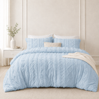 Dusty Blue tufted comforter set on a bed