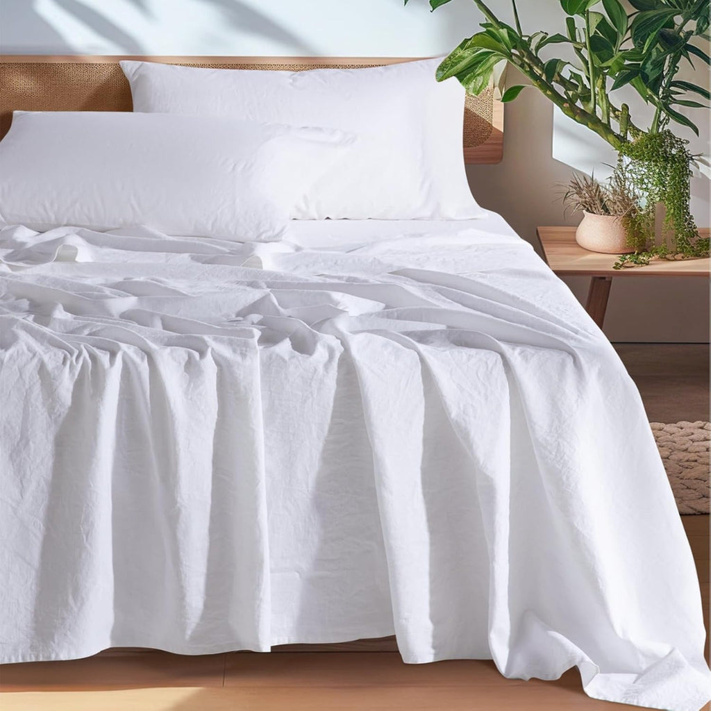 White European linen sheet set on an oak bed