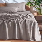 Gray European linen sheet set on an oak bed