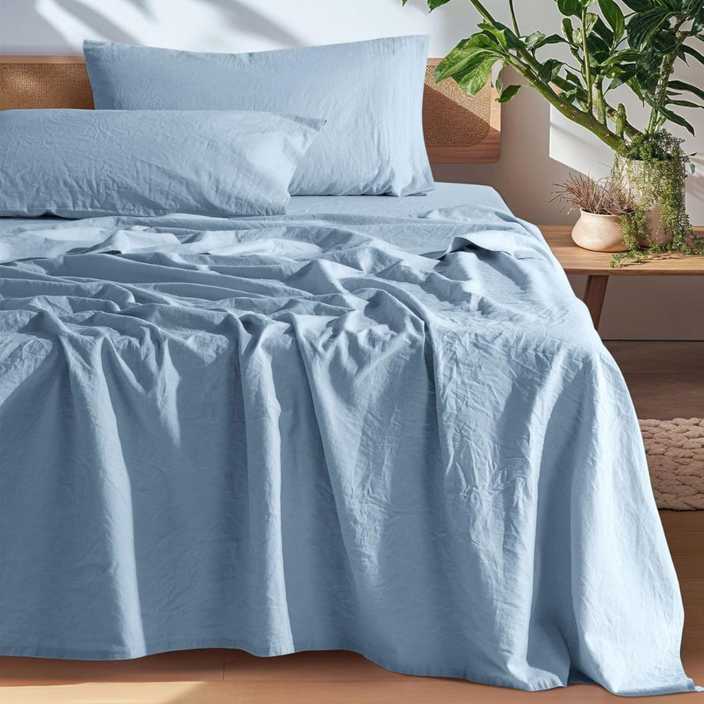 Blue European linen sheet set on an oak bed