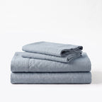 Folded stack of Blue European linen sheets