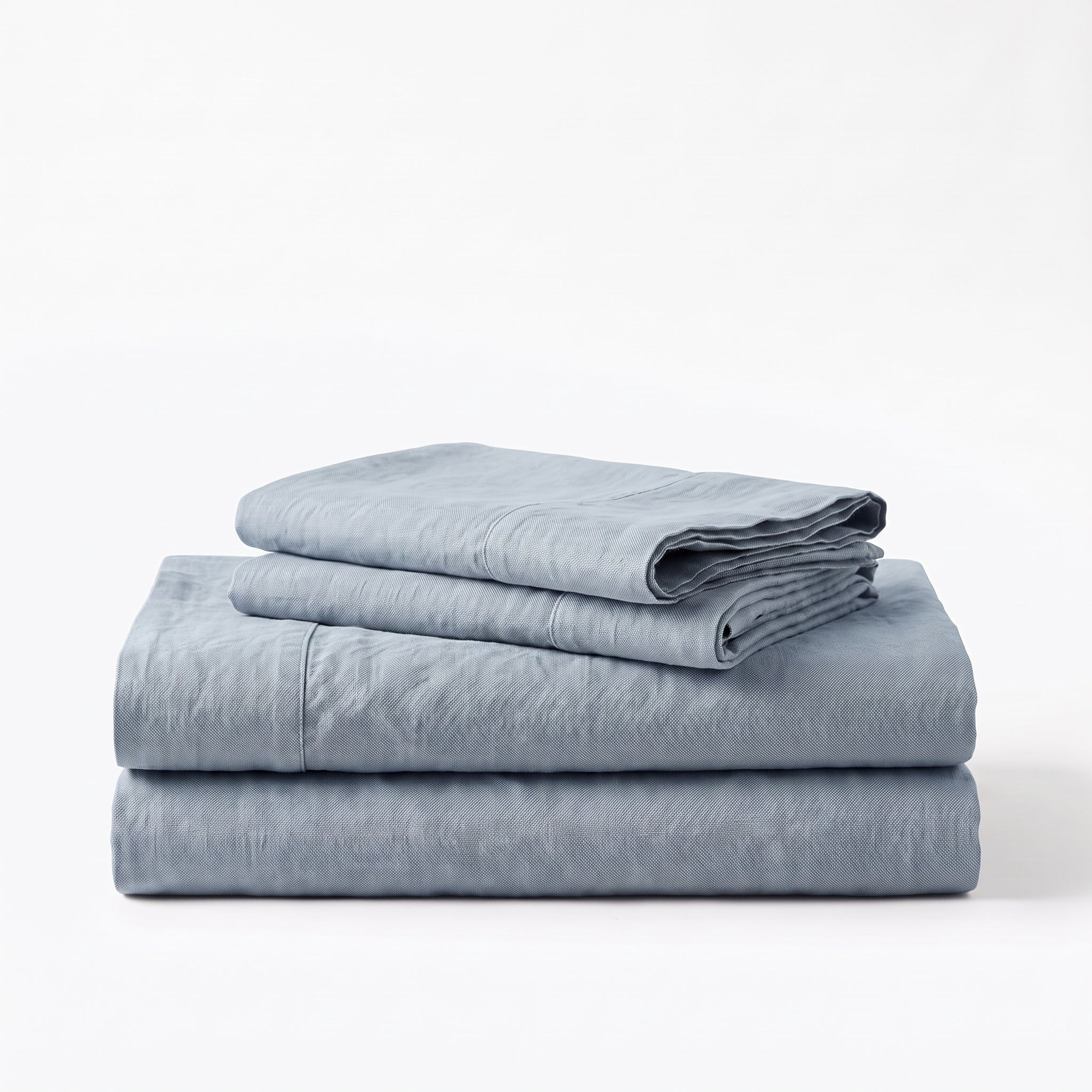 Folded stack of Blue European linen sheets