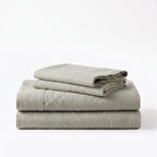 Folded stack of Green European linen sheets