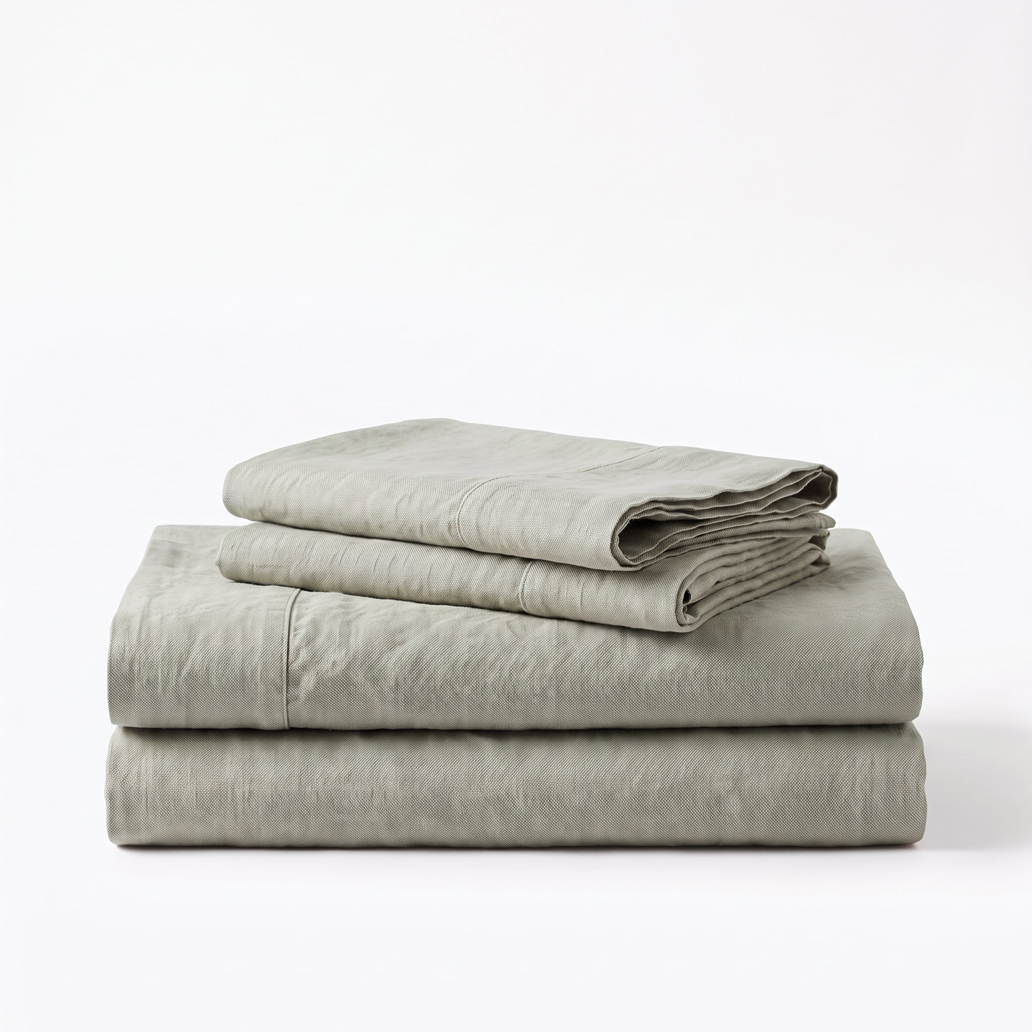 Folded stack of Green European linen sheets
