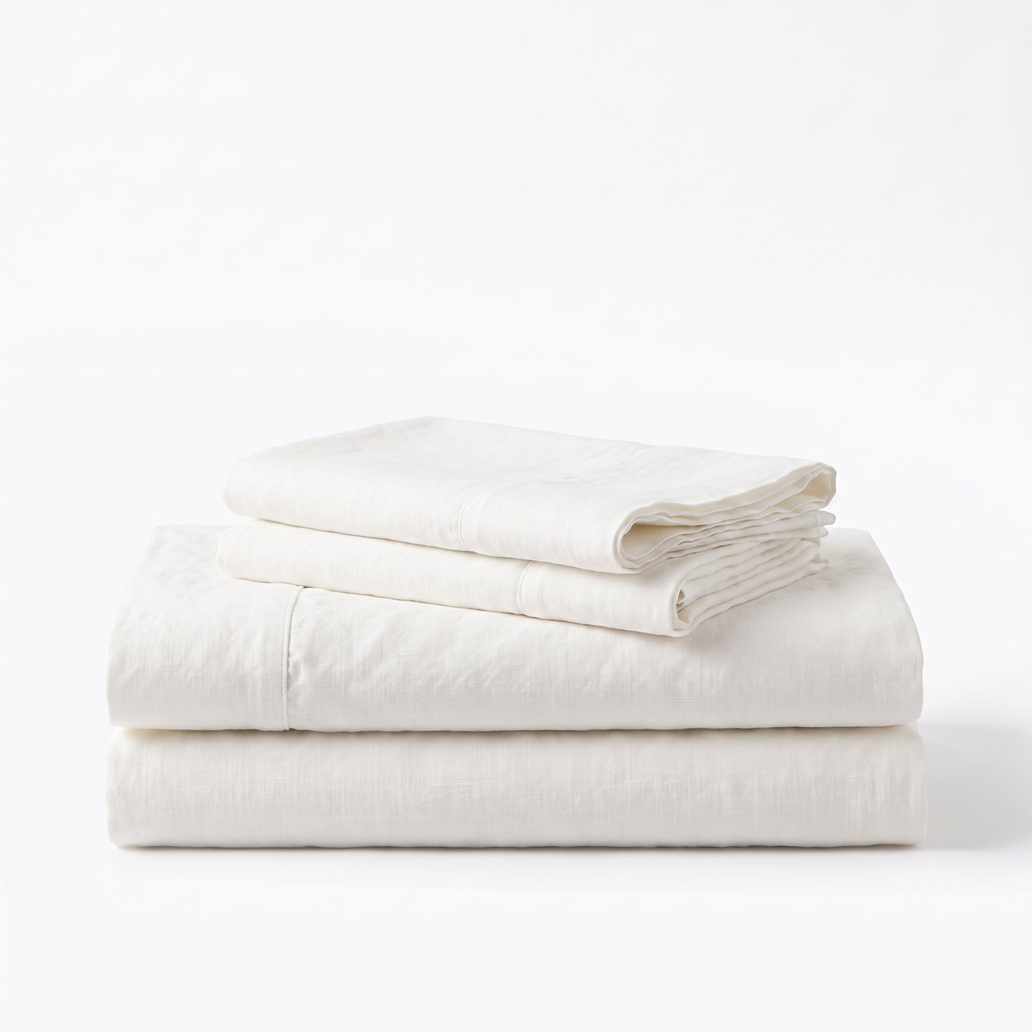 Folded stack of White European linen sheets